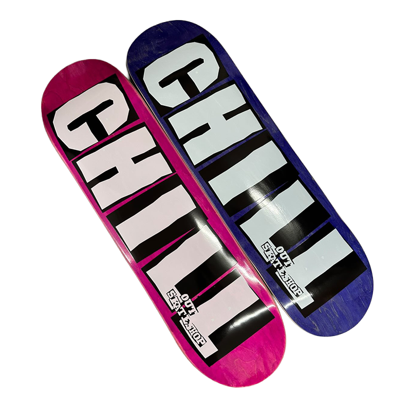 Two skateboard decks with 'CHILL OUT SKATESHOP' branding on a white background